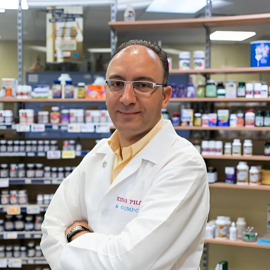 pharmacist greeting a patient inside King Pharmacy